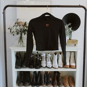 Cropped black turtle neck with cutout red heart
